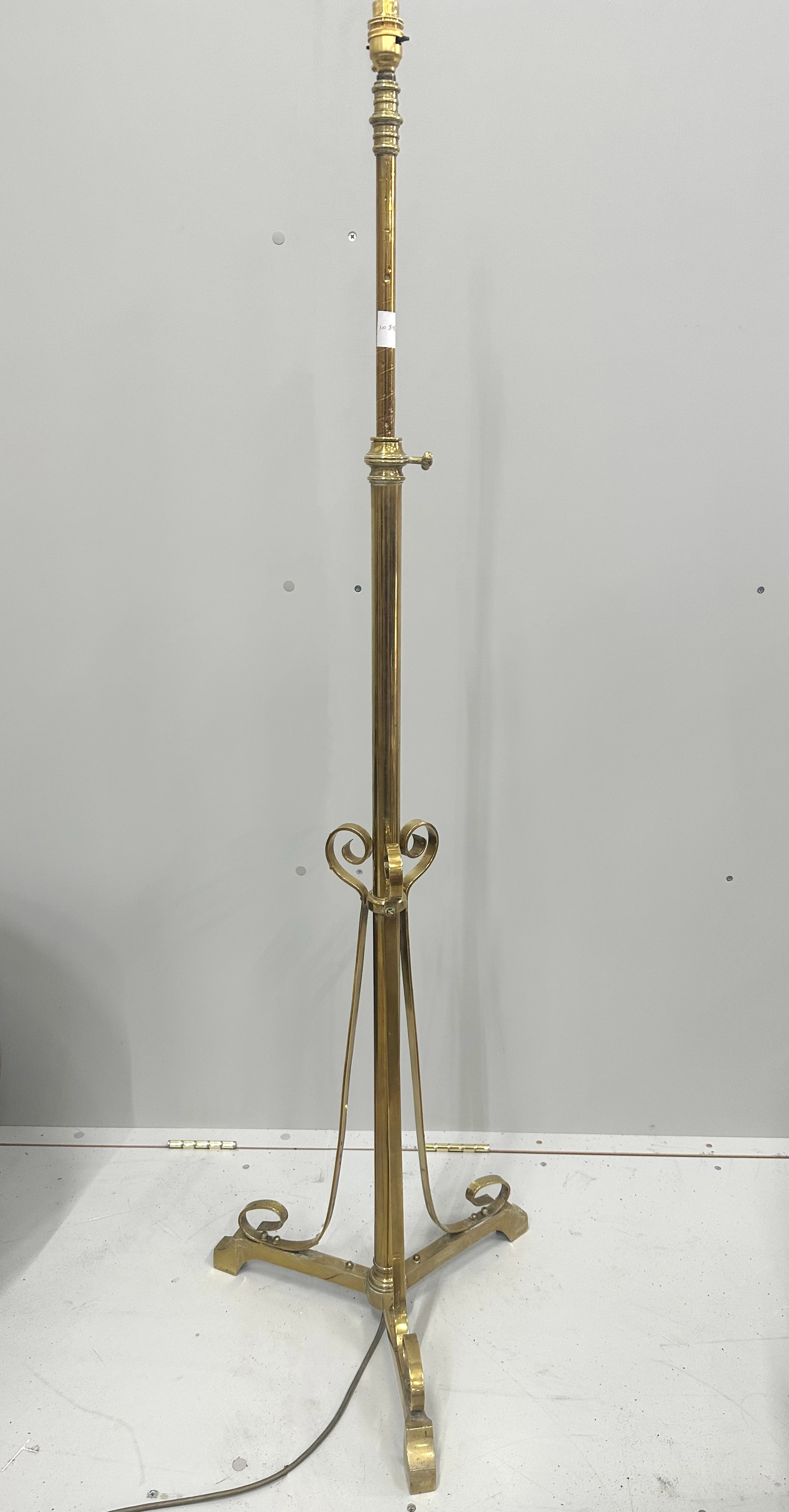 An Art Nouveau brass telescopic standard lamp, converted to electricity